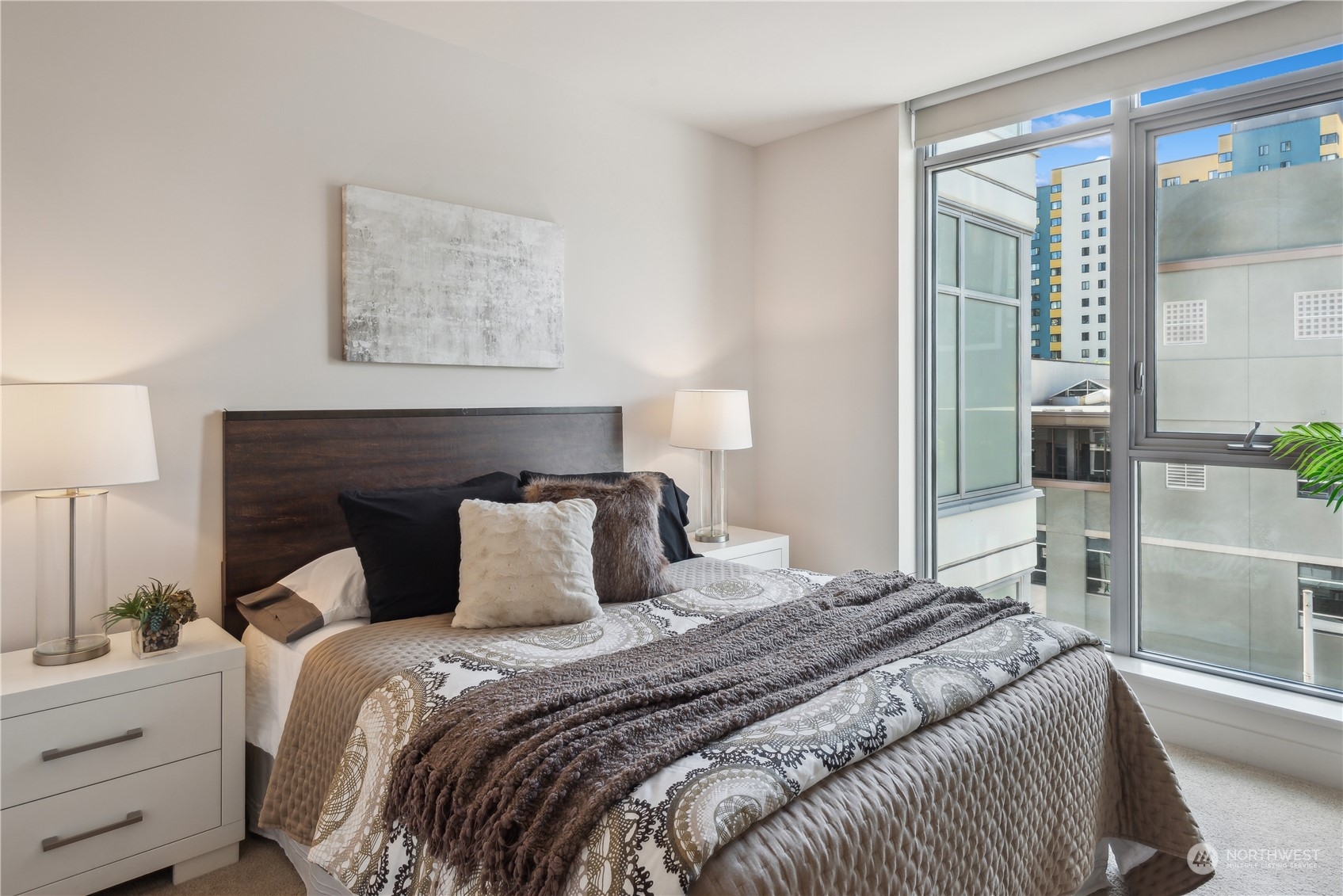 583 Battery Street, Unit 506N Seattle, WA 98121 - Photo 12 of 36 a bedroom with a bed and a window