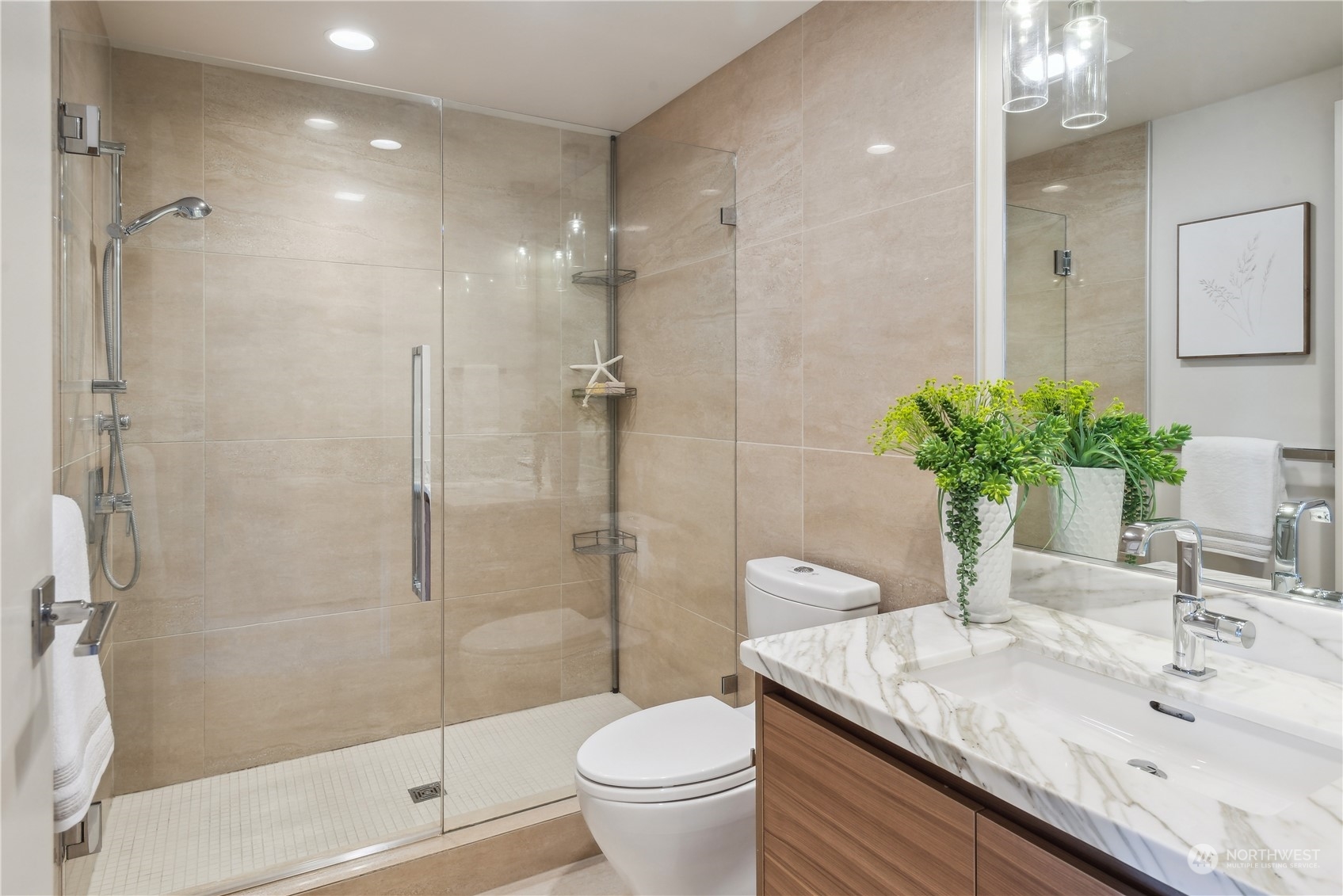 583 Battery Street, Unit 506N Seattle, WA 98121 - Photo 14 of 36 a bathroom with a granite countertop sink a toilet and shower