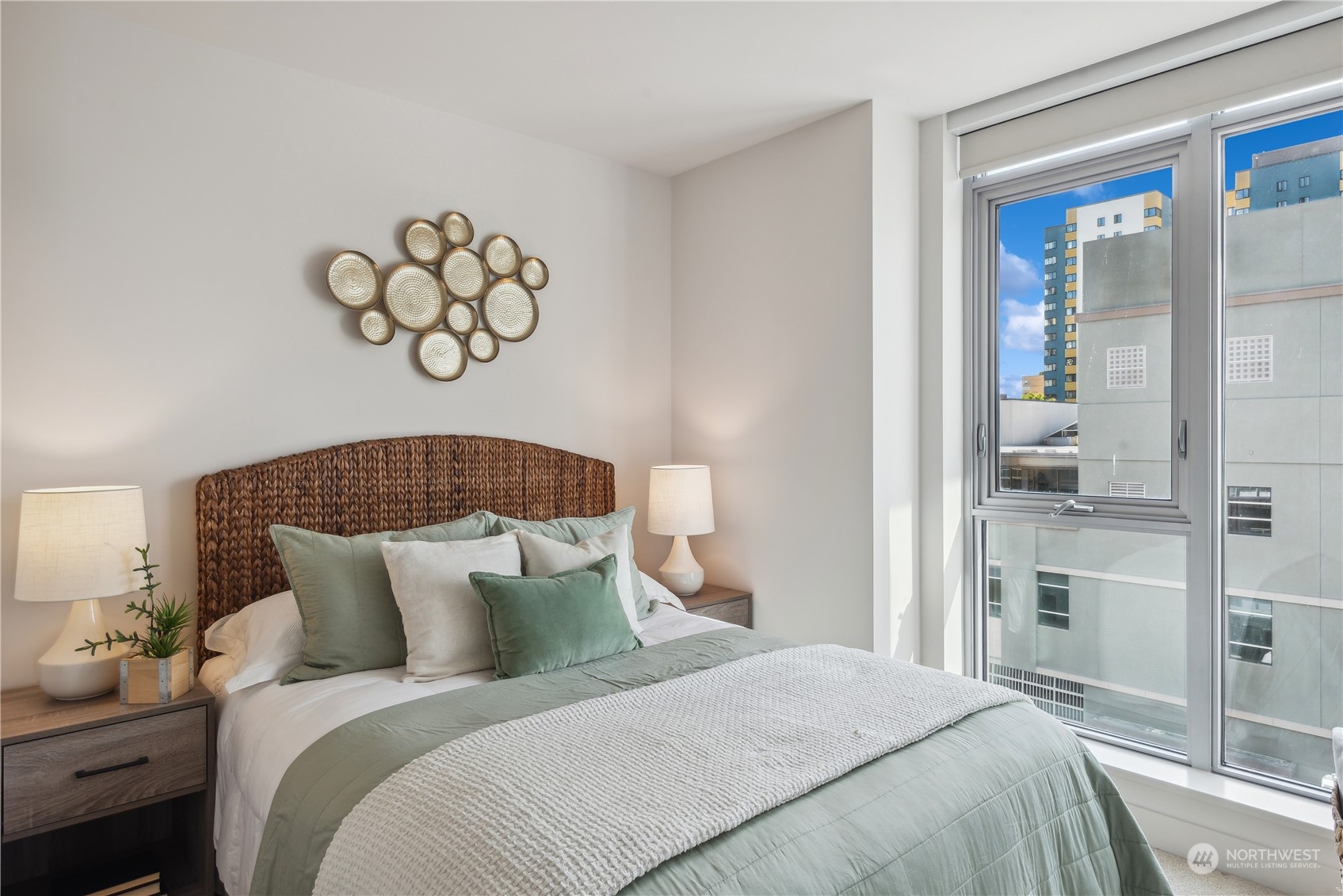 583 Battery Street, Unit 506N Seattle, WA 98121 - Photo 16 of 36 a bedroom with a bed and dresser with mirror