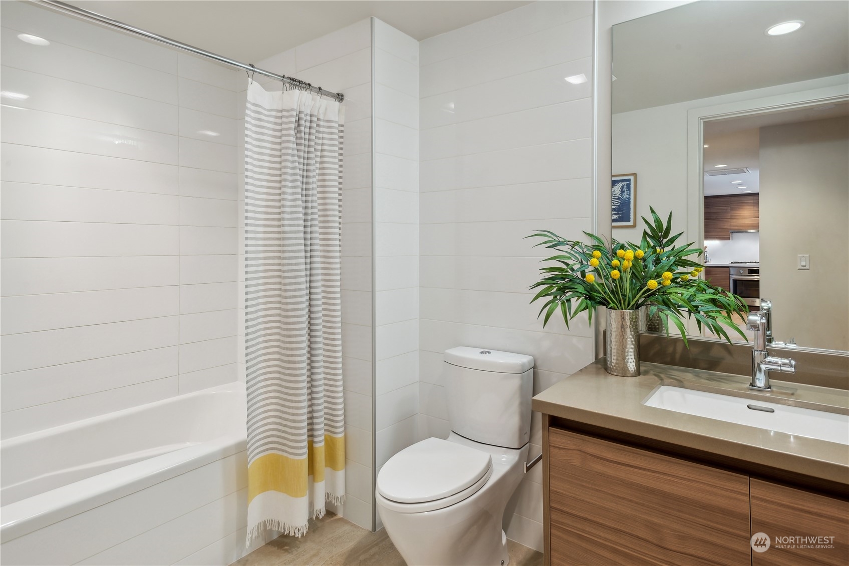 583 Battery Street, Unit 506N Seattle, WA 98121 - Photo 17 of 36 a bathroom with a toilet a sink and a bathtub