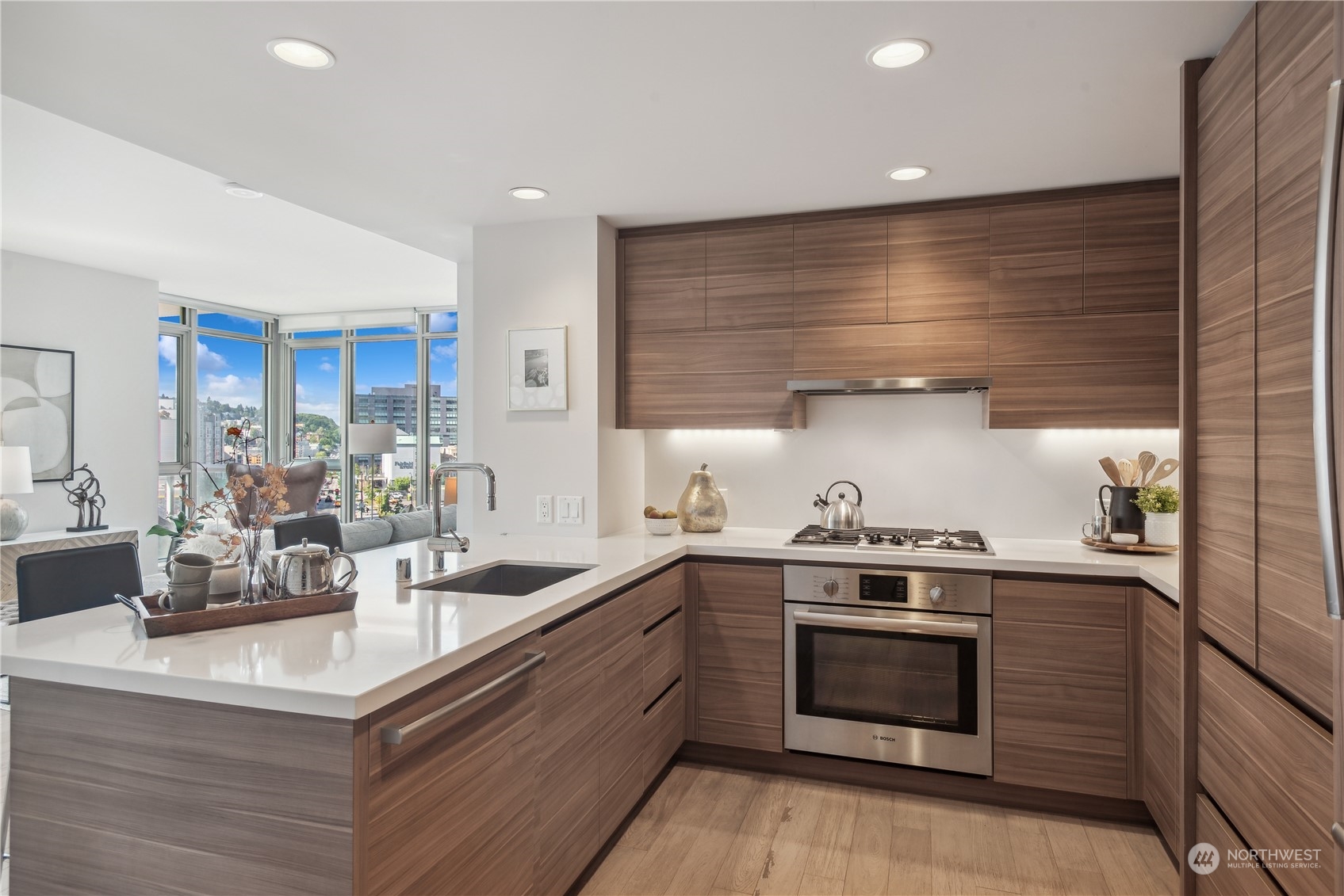 583 Battery Street, Unit 506N Seattle, WA 98121 - Photo 3 of 36 a kitchen with stainless steel appliances granite countertop a stove a sink and a refrigerator