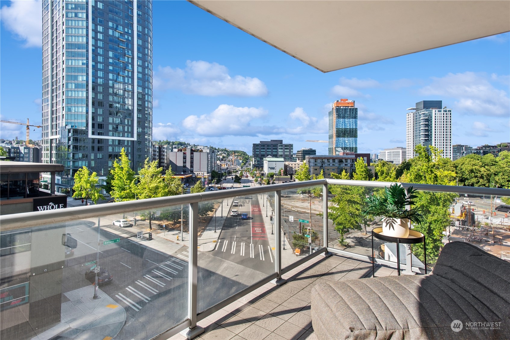 583 Battery Street, Unit 506N Seattle, WA 98121 - Photo 7 of 36 a balcony with outdoor seating and plants