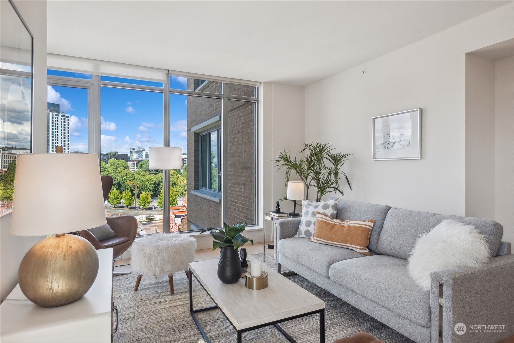 583 Battery Street, Unit 506N Seattle, WA 98121 - Photo 9 of 36 a living room with furniture and a large mirror