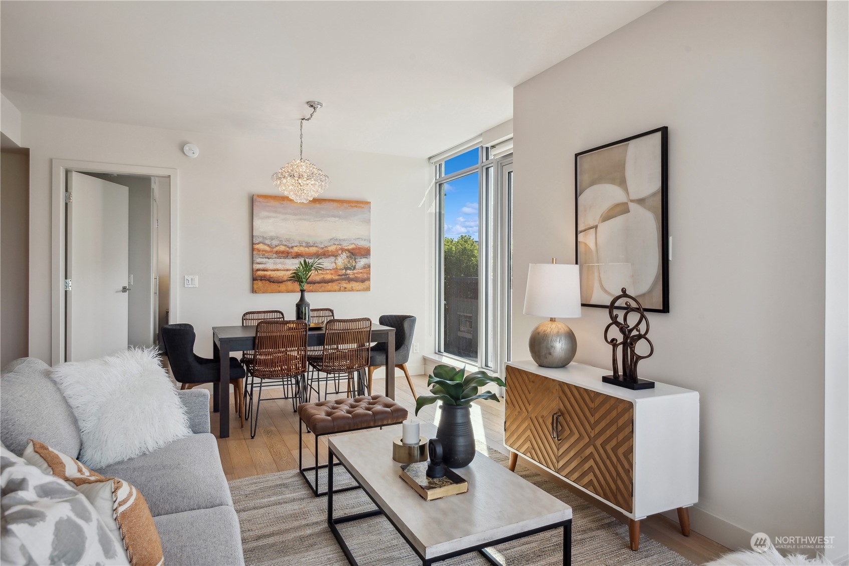 583 Battery Street, Unit 506N Seattle, WA 98121 - Photo 10 of 36 a living room with furniture and wooden floor