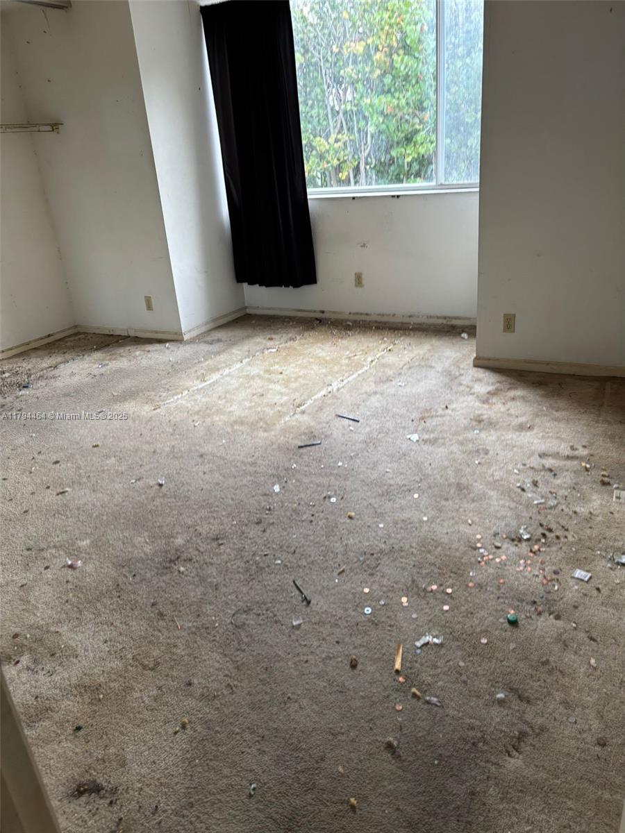 5040 Elmhurst Road, Unit A West Palm Beach, FL 33417 - Photo 12 of 12 a view of an empty room with a window