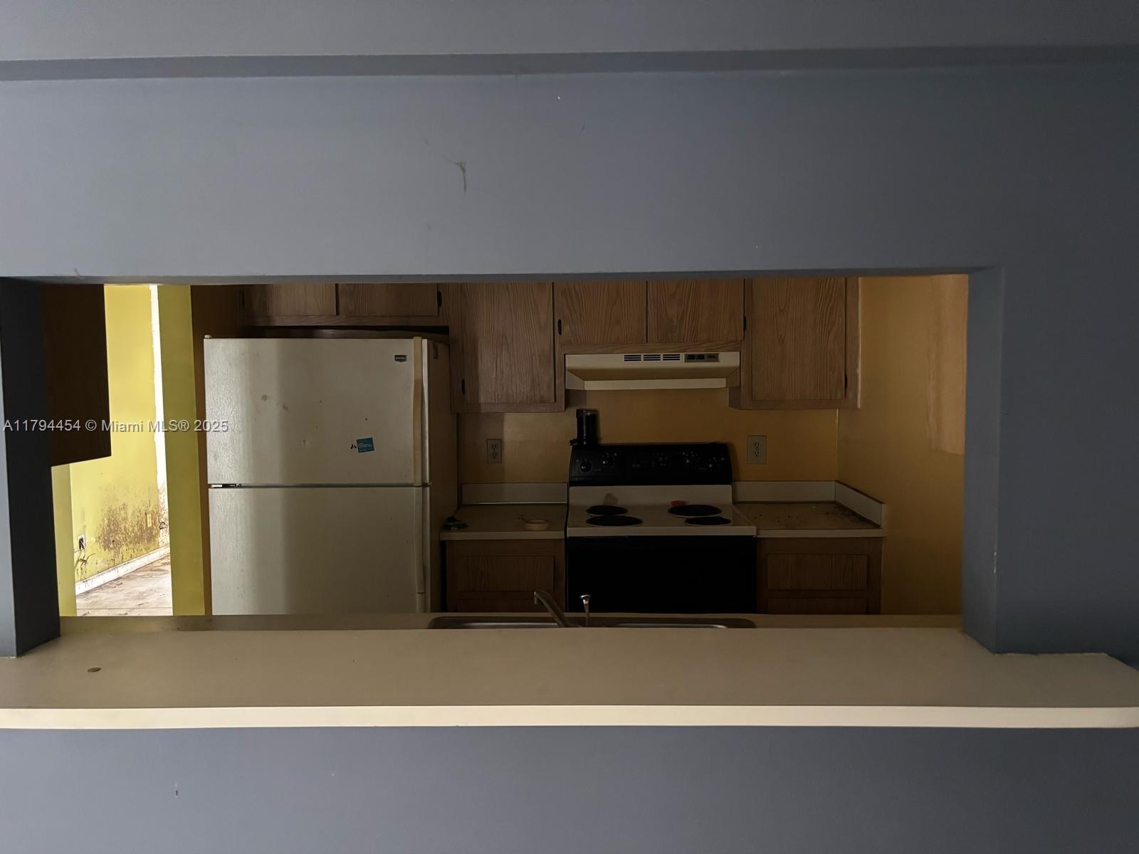 5040 Elmhurst Road, Unit A West Palm Beach, FL 33417 - Photo 3 of 12 a room with storage and utility