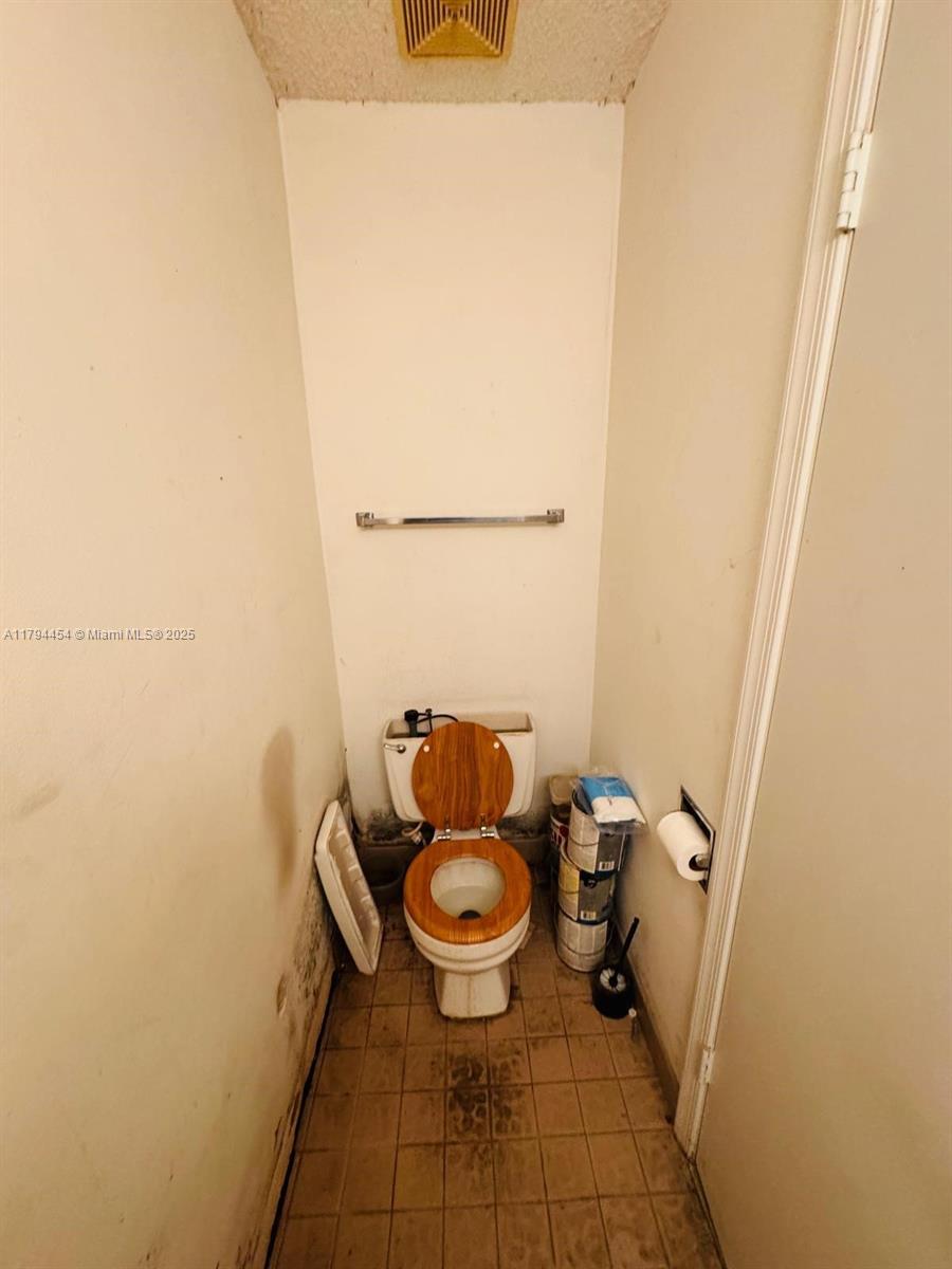 5040 Elmhurst Road, Unit A West Palm Beach, FL 33417 - Photo 7 of 12 a bathroom with a toilet
