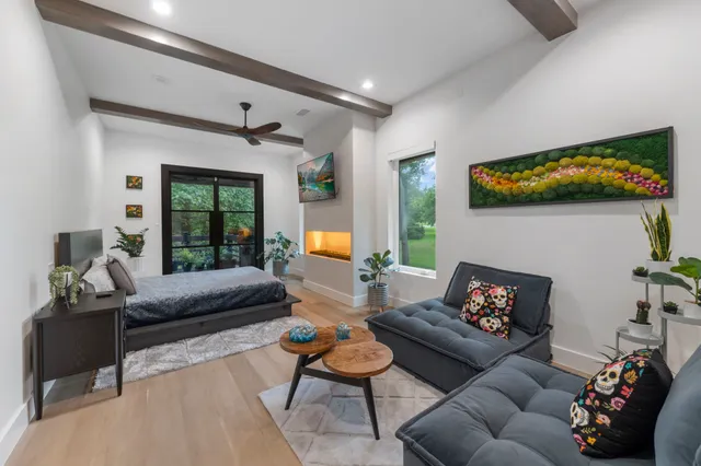 a view of a chairs and table on the wooden deck