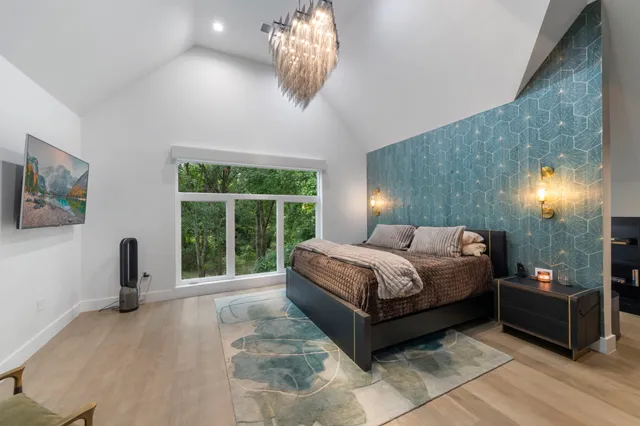 an outdoor living area with furniture and a fireplace