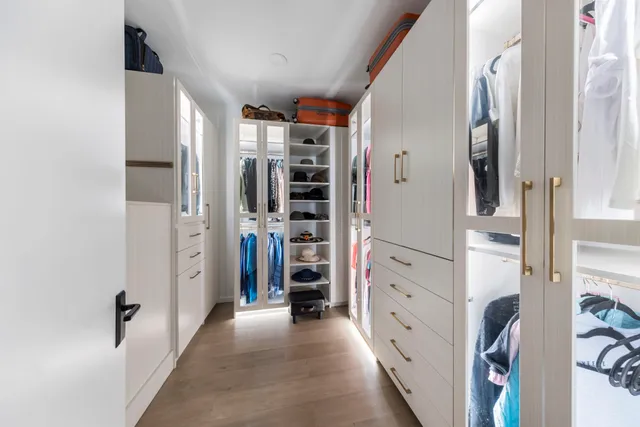 a kitchen with stainless steel appliances granite countertop a sink and a refrigerator