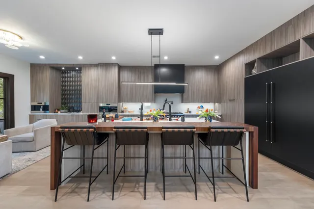 a kitchen with a table and chairs in it