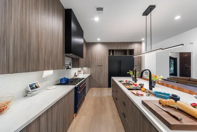 a kitchen with a table and chairs in it