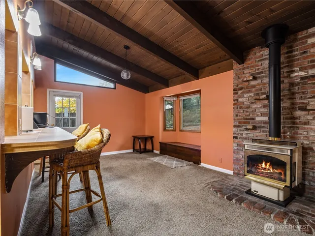 a dining room with furniture and window