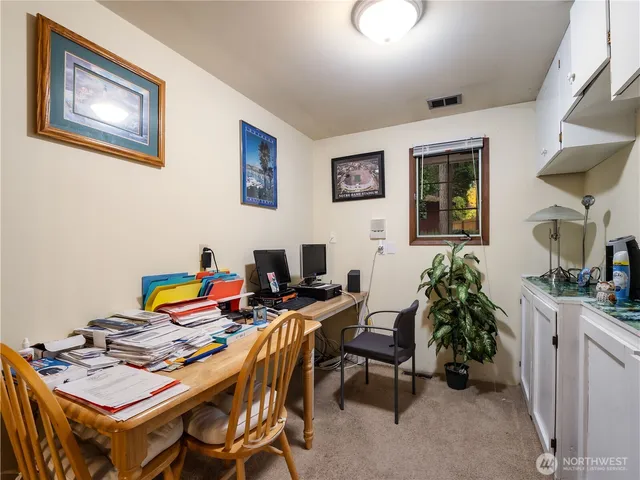 a workspace with furniture and rug