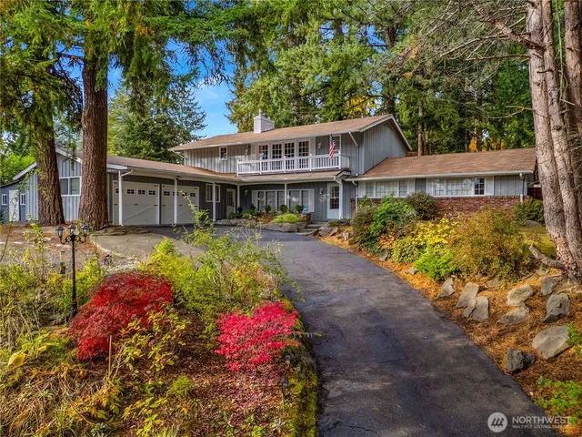 a view of a house with a yard and garden