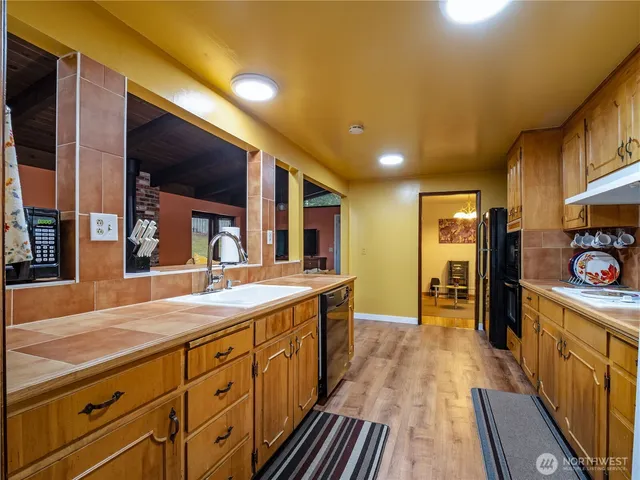 a spacious bathroom with a sink and a large mirror