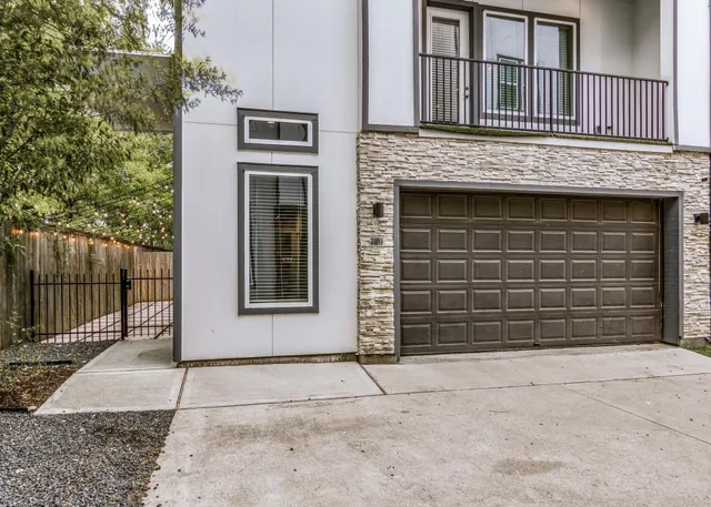 a front view of a house with a garage