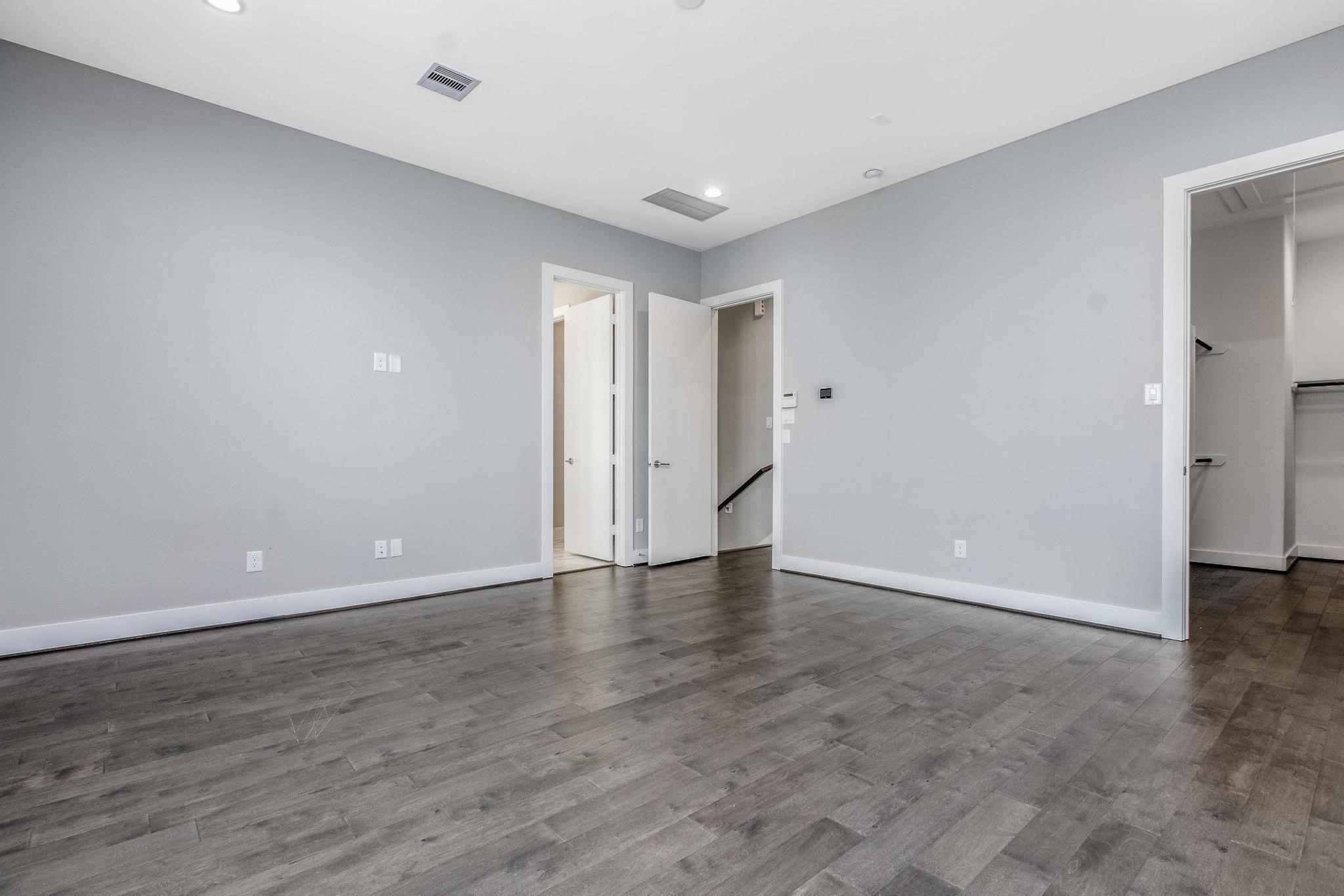 8409 Hempstead Road, Unit F Houston, TX 77008 - Photo 17 of 23 a view of an empty room with wooden floor