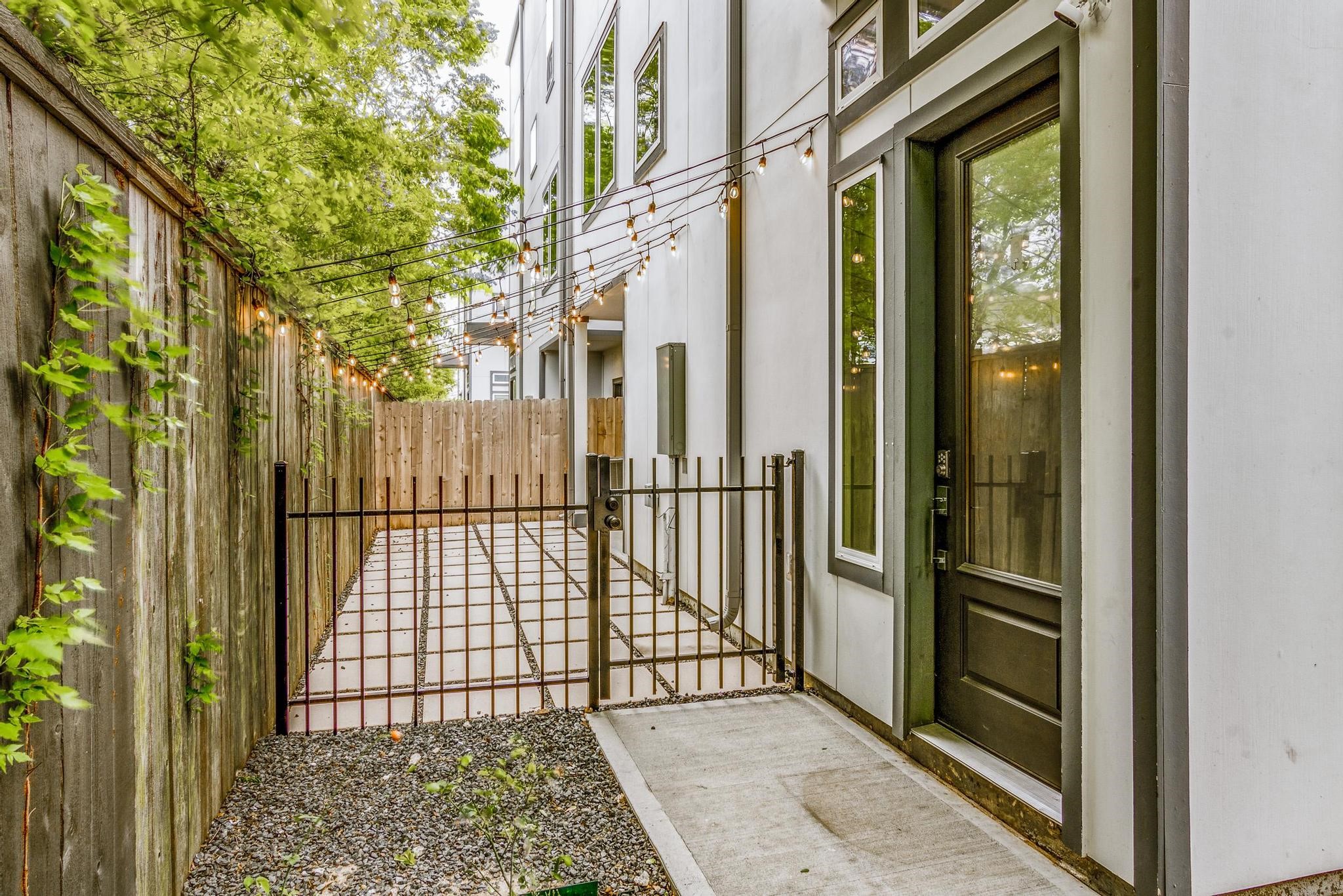8409 Hempstead Road, Unit F Houston, TX 77008 - Photo 2 of 23 a view of a balcony with a door