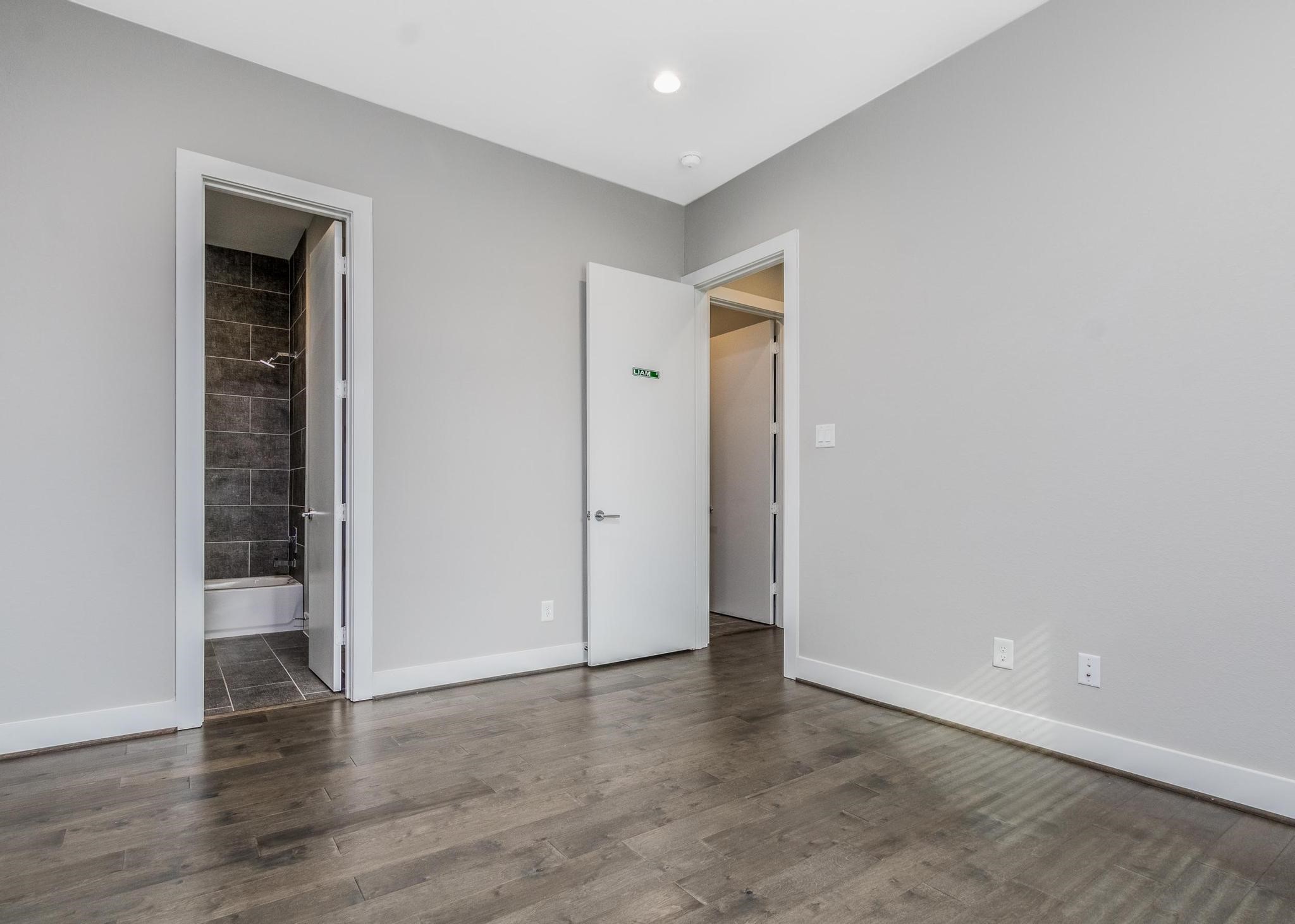 8409 Hempstead Road, Unit F Houston, TX 77008 - Photo 21 of 23 wooden floor in an empty room