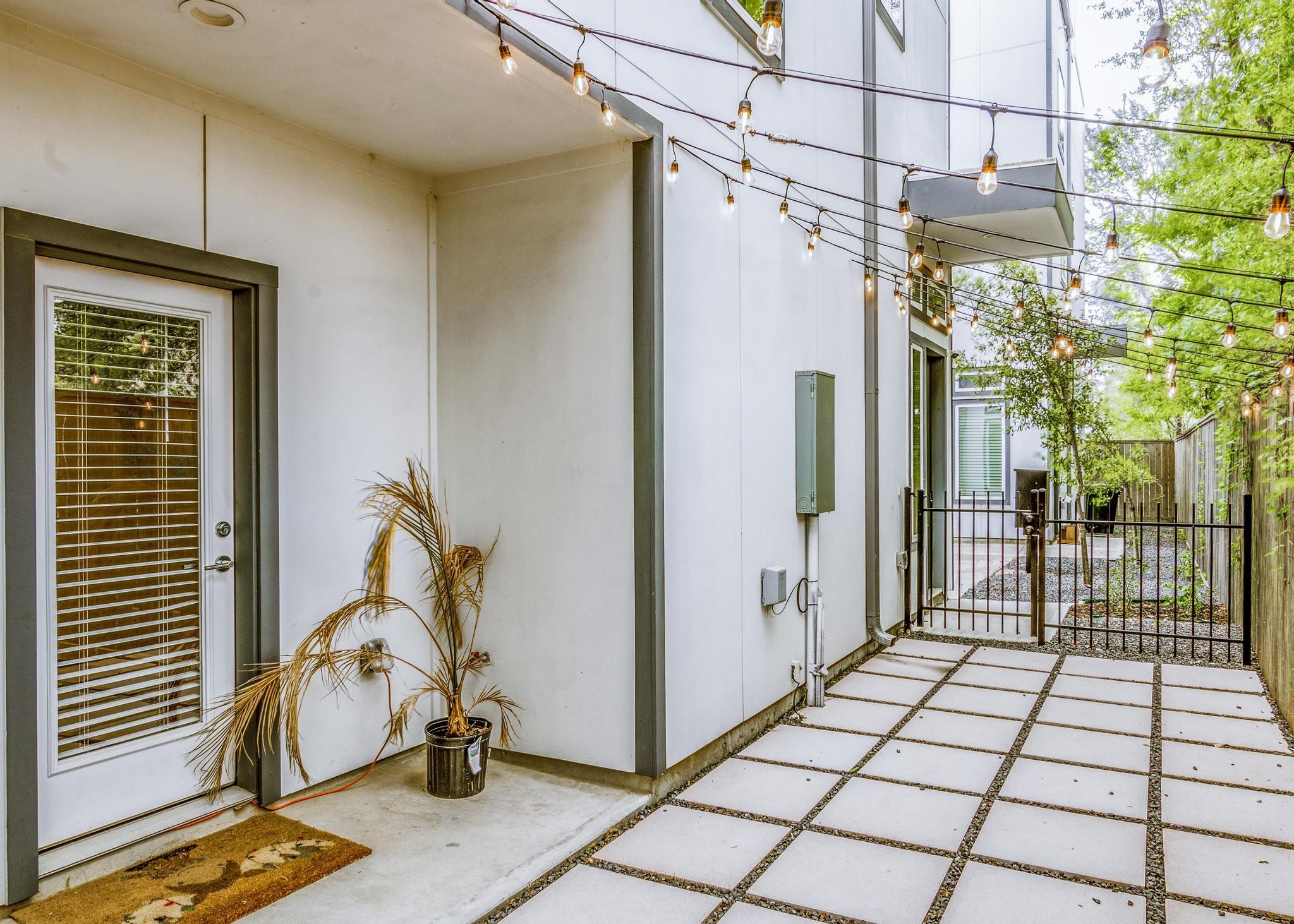 8409 Hempstead Road, Unit F Houston, TX 77008 - Photo 3 of 23 a view of a porch with wooden floor and a potted plant