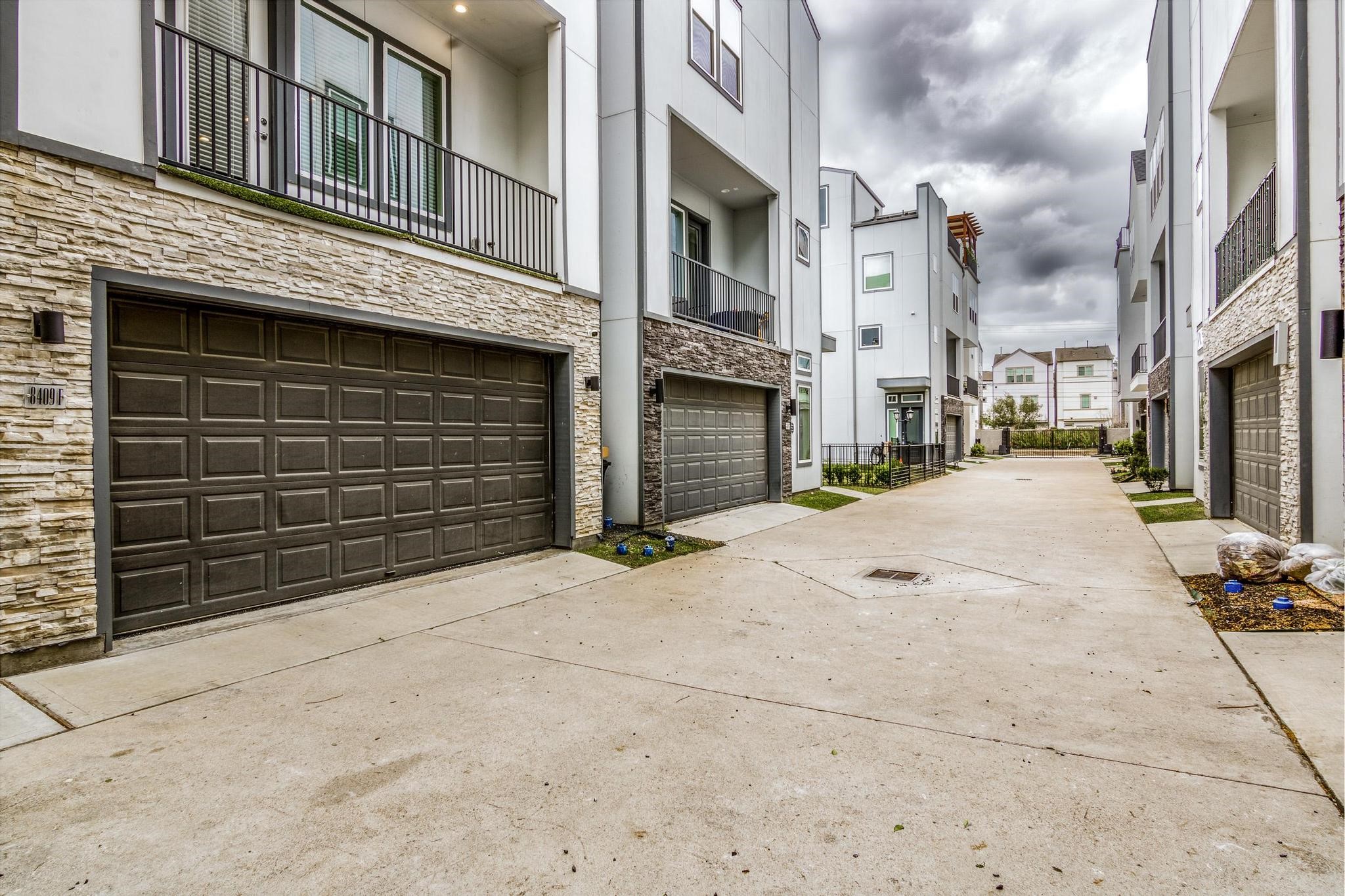 8409 Hempstead Road, Unit F Houston, TX 77008 - Photo 6 of 23 a view of a street with buildings in the background