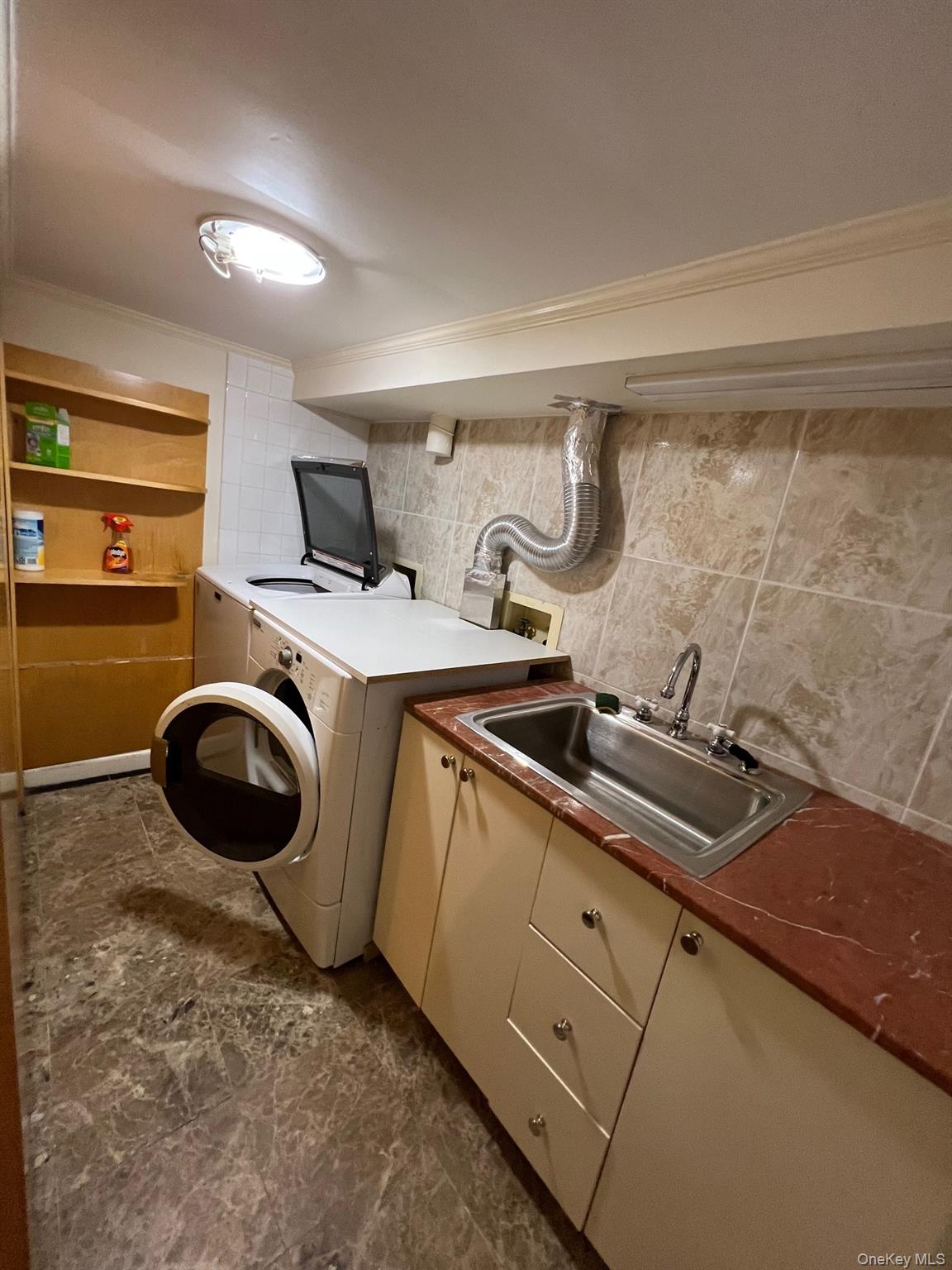 52-62 68th Street Queens, NY 11378 - Photo 15 of 15 a room with storage and utility