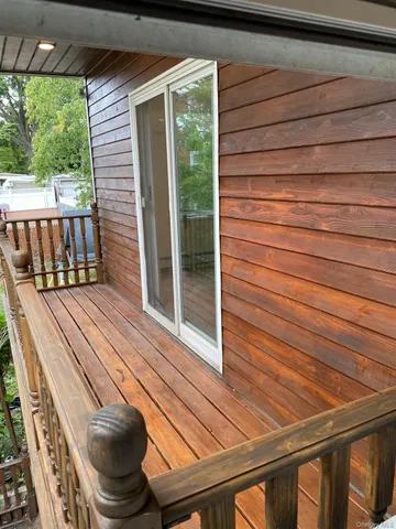 a view of a two chairs in the balcony