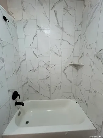 a bathroom with bathtub