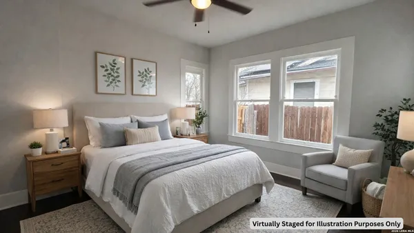 a spacious bedroom with a bed and a chandelier