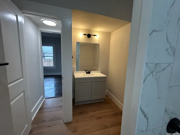a bathroom with a sink and a mirror
