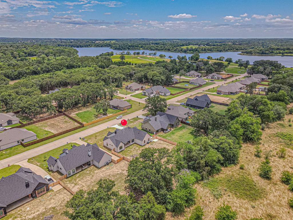 360 Dalton Road Canton, TX 75103 - Photo 30 of 33 Residential property with a dark gray shingle roof and light-colored siding, situated on a paved street