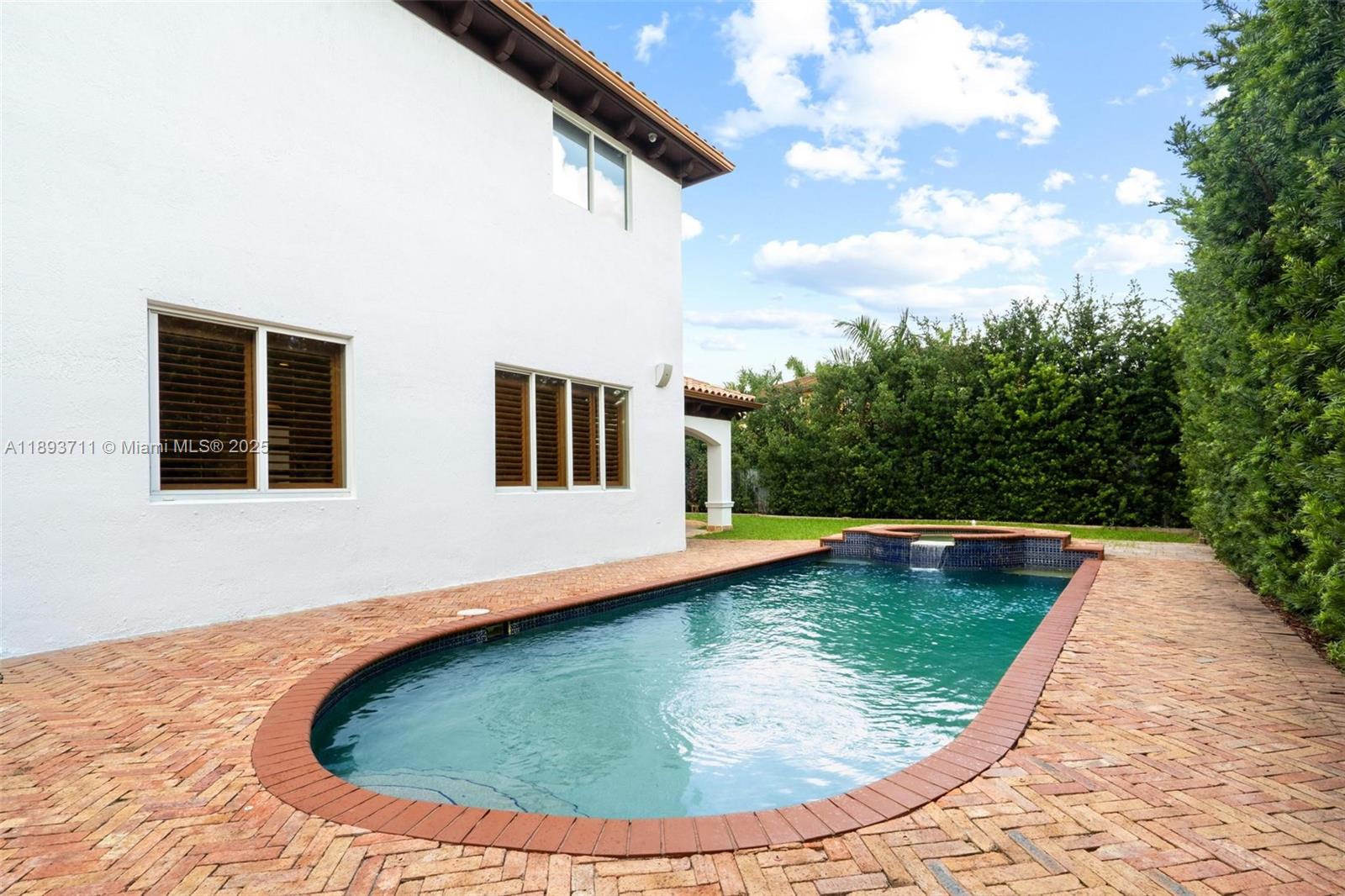 16763 Northwest 77th Path Miami Lakes, FL 33016 - Photo 11 of 53 a view of a swimming pool with an outdoor space