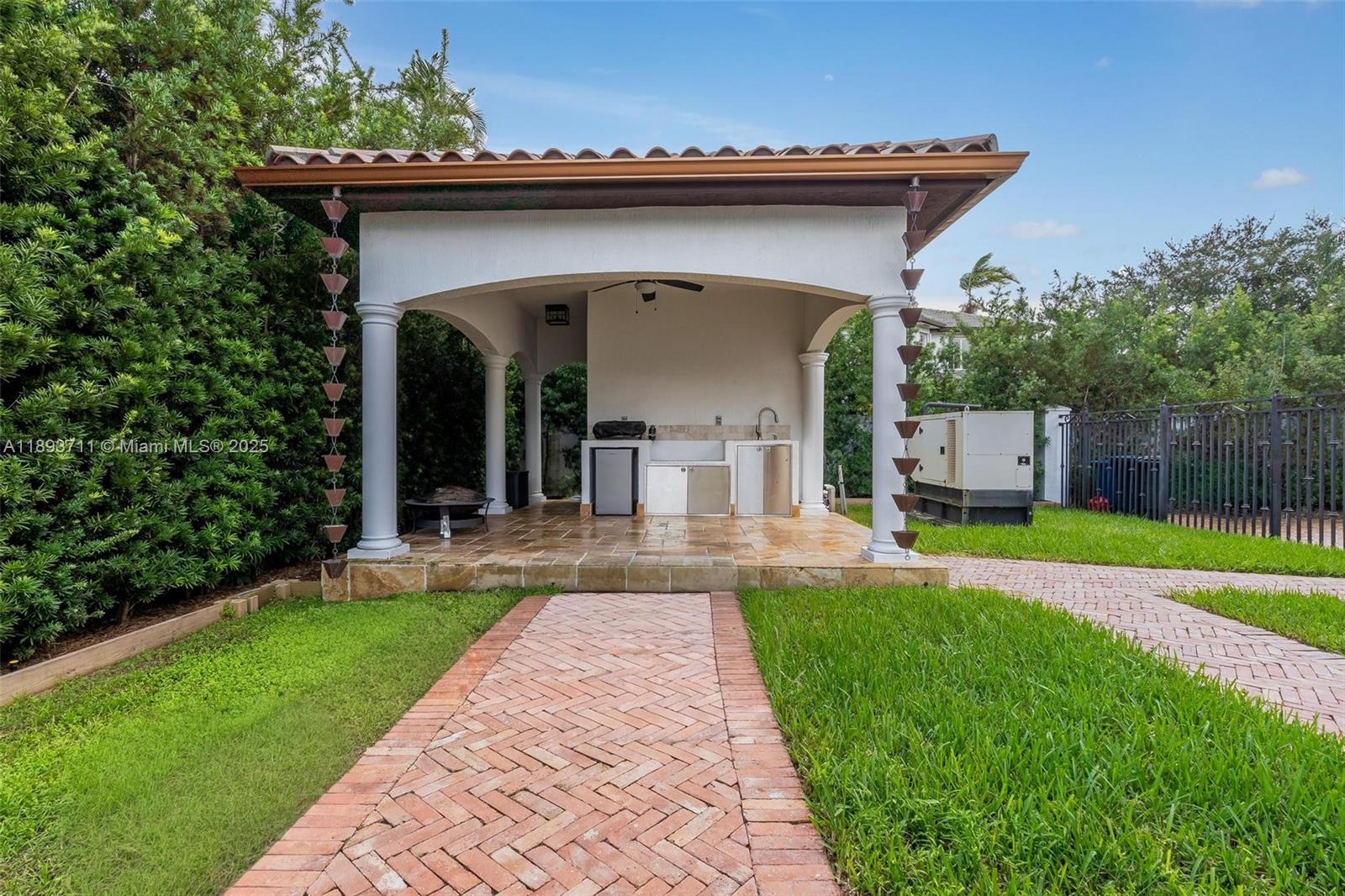 16763 Northwest 77th Path Miami Lakes, FL 33016 - Photo 13 of 53 a view of a house with a yard and potted plants