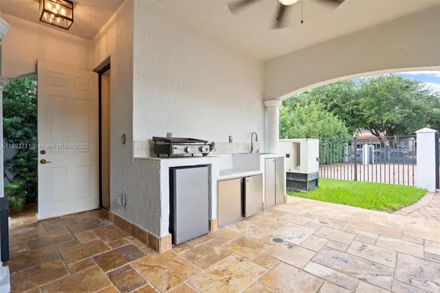 a bathroom with a shower a toilet and a sink
