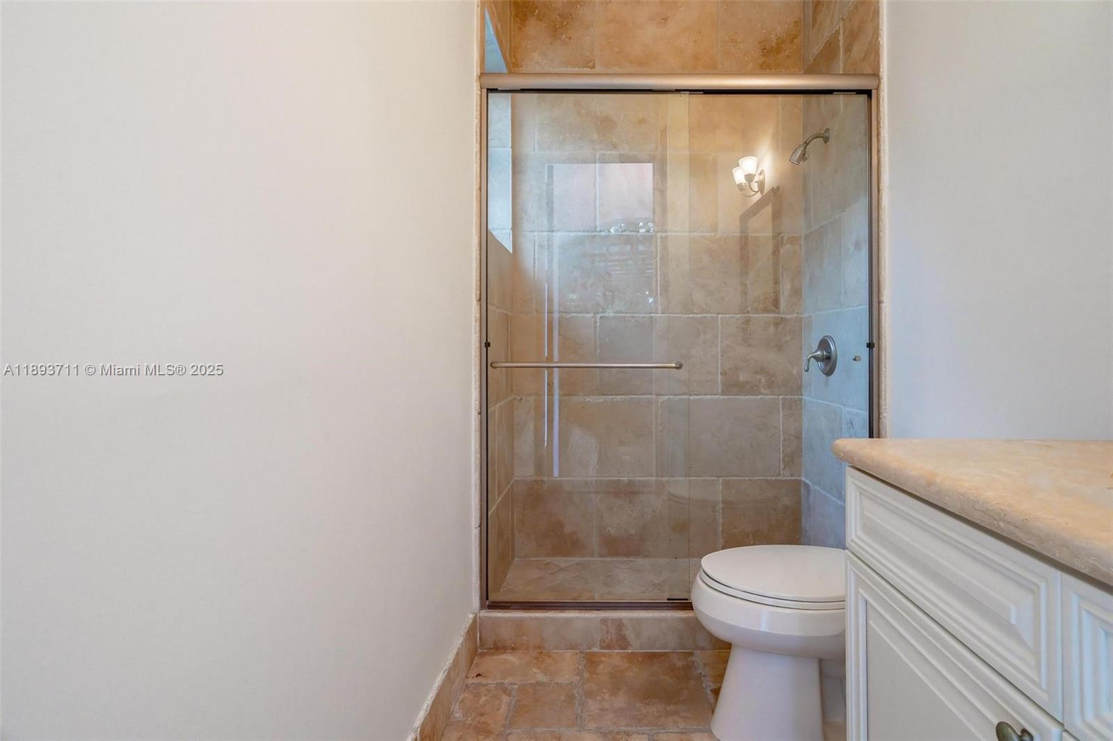 16763 Northwest 77th Path Miami Lakes, FL 33016 - Photo 15 of 53 a bathroom with a shower a toilet and a sink