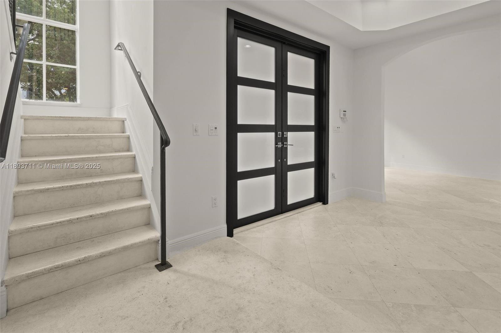 16763 Northwest 77th Path Miami Lakes, FL 33016 - Photo 16 of 53 a view of staircase with lots of frames on wall and a window