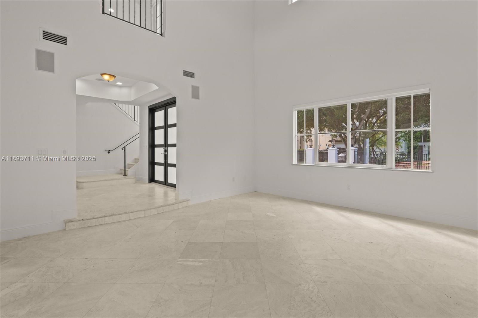 16763 Northwest 77th Path Miami Lakes, FL 33016 - Photo 18 of 53 an empty room with windows and closet