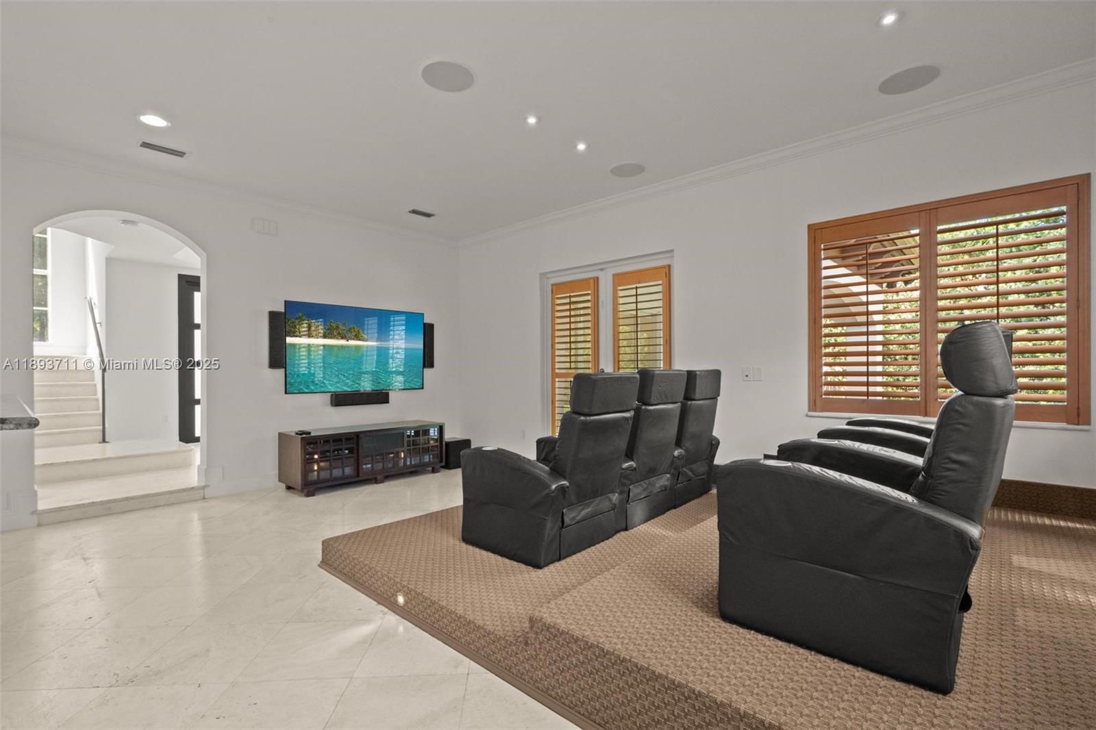 16763 Northwest 77th Path Miami Lakes, FL 33016 - Photo 21 of 53 a living room with furniture and a flat screen tv