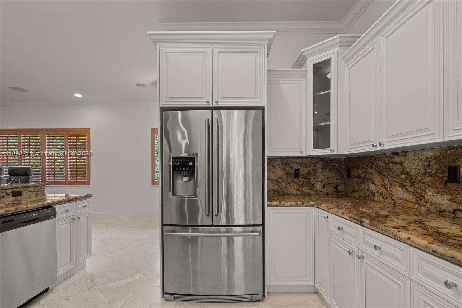 16763 Northwest 77th Path Miami Lakes, FL 33016 - Photo 25 of 53 a kitchen with stainless steel appliances granite countertop a refrigerator and a stove