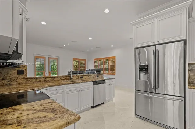 a view of a hallway with chandelier