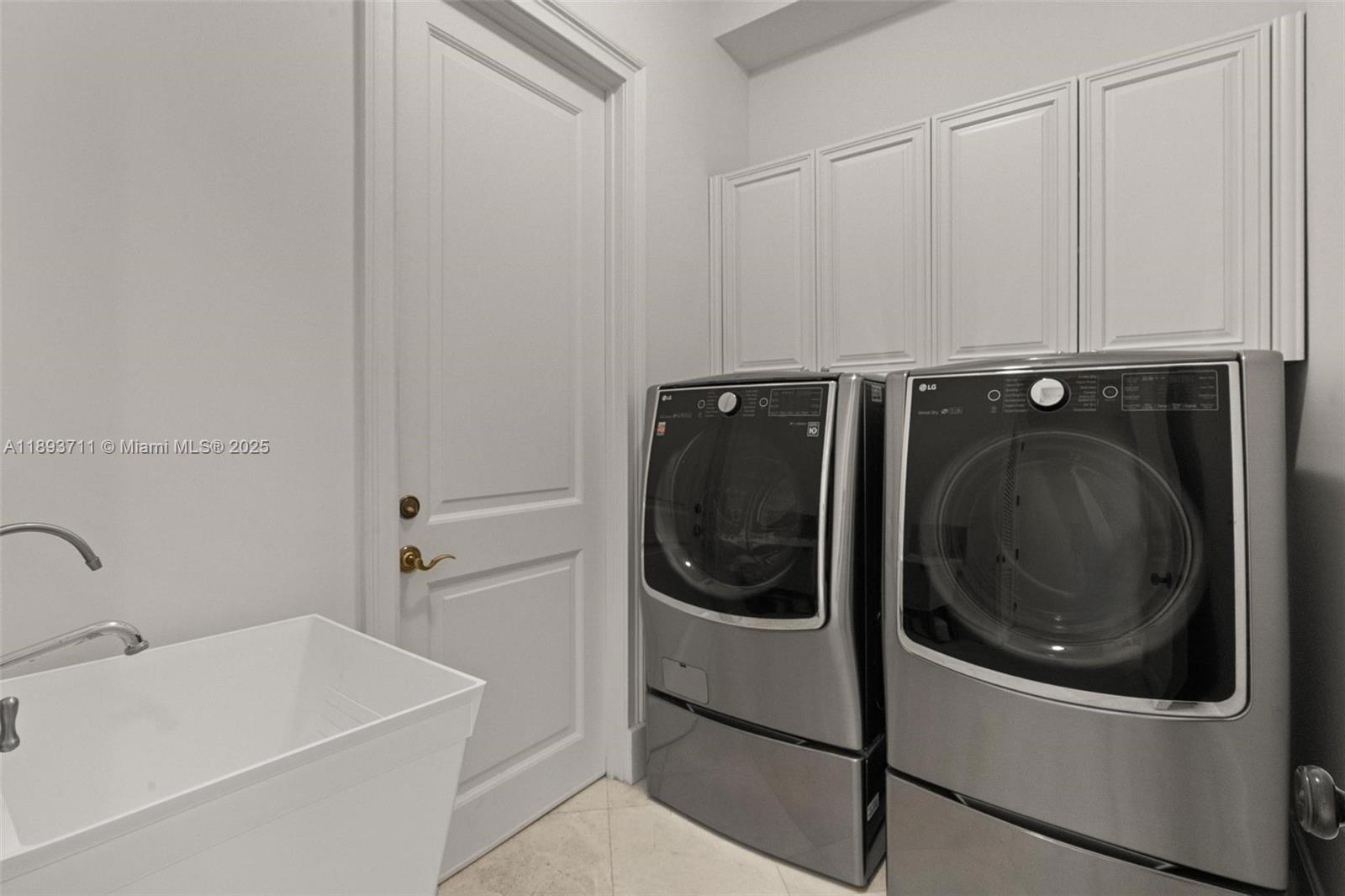 16763 Northwest 77th Path Miami Lakes, FL 33016 - Photo 29 of 53 a utility room with sink dryer and washer