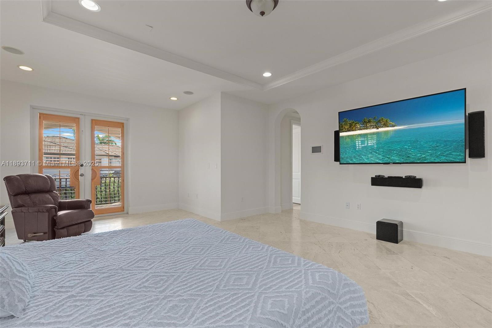 16763 Northwest 77th Path Miami Lakes, FL 33016 - Photo 35 of 53 a view of a livingroom with a flat screen tv