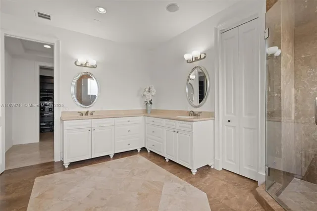 a bathroom with a toilet and a shower curtain