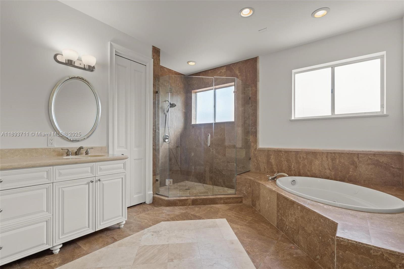 16763 Northwest 77th Path Miami Lakes, FL 33016 - Photo 38 of 53 a bathroom with a granite countertop sink mirror vanity and toilet