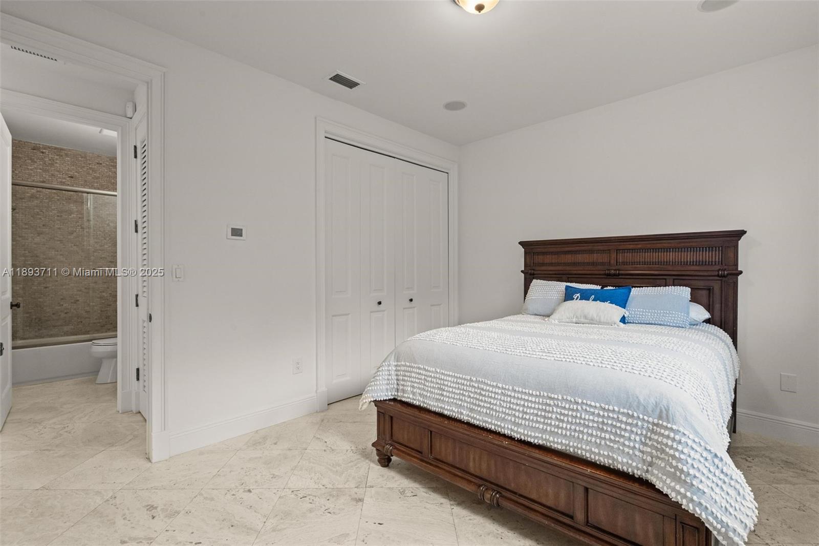 16763 Northwest 77th Path Miami Lakes, FL 33016 - Photo 42 of 53 a bedroom with a bed and closet