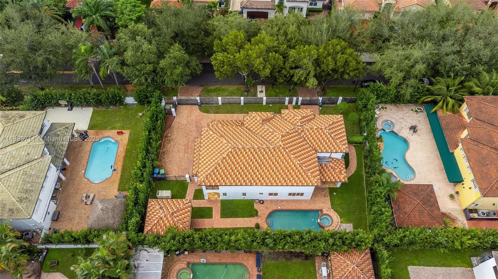 16763 Northwest 77th Path Miami Lakes, FL 33016 - Photo 47 of 53 aerial view of a house with a yard and potted plants