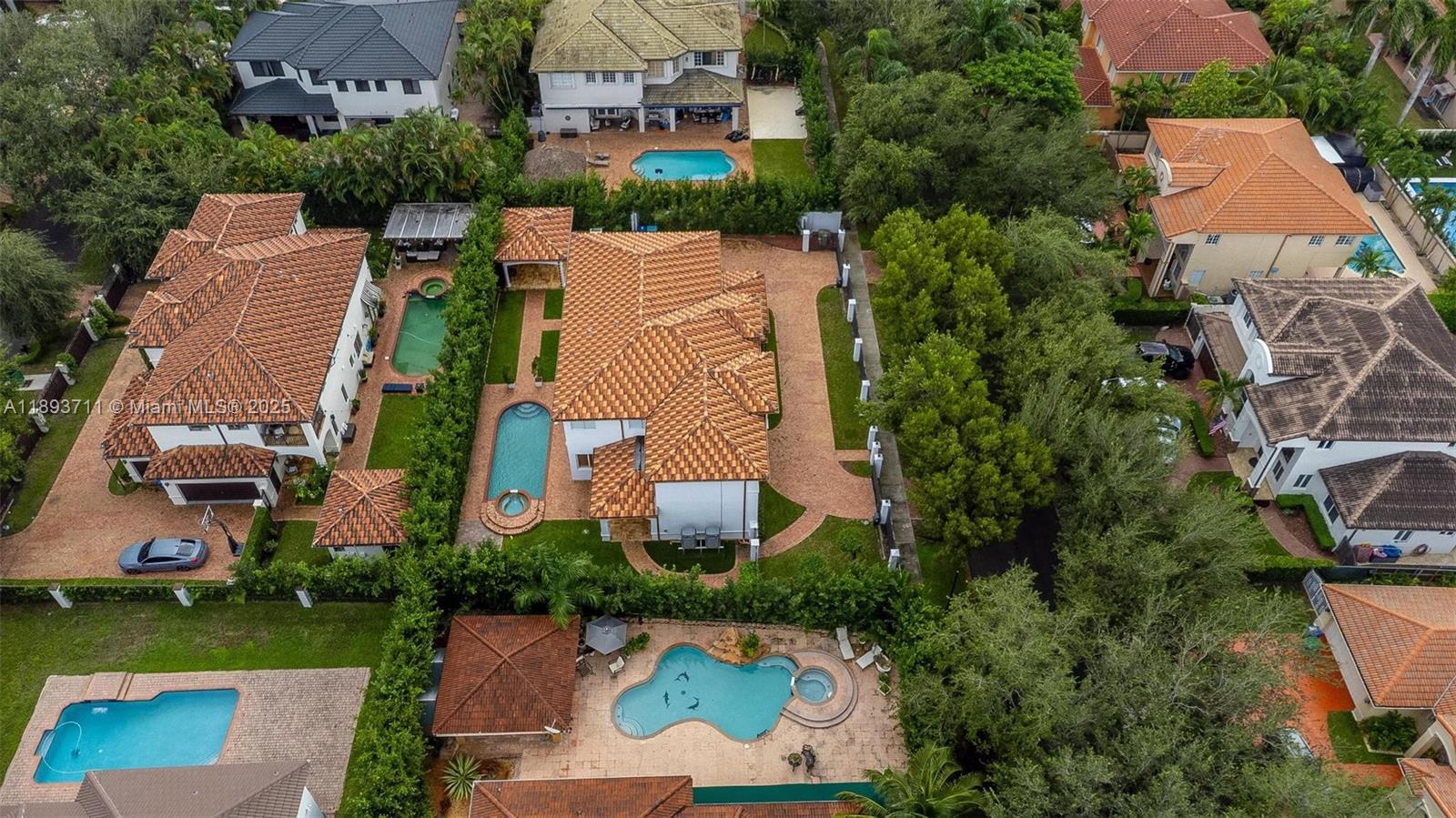 16763 Northwest 77th Path Miami Lakes, FL 33016 - Photo 48 of 53 an aerial view of a house with a garden and lake view