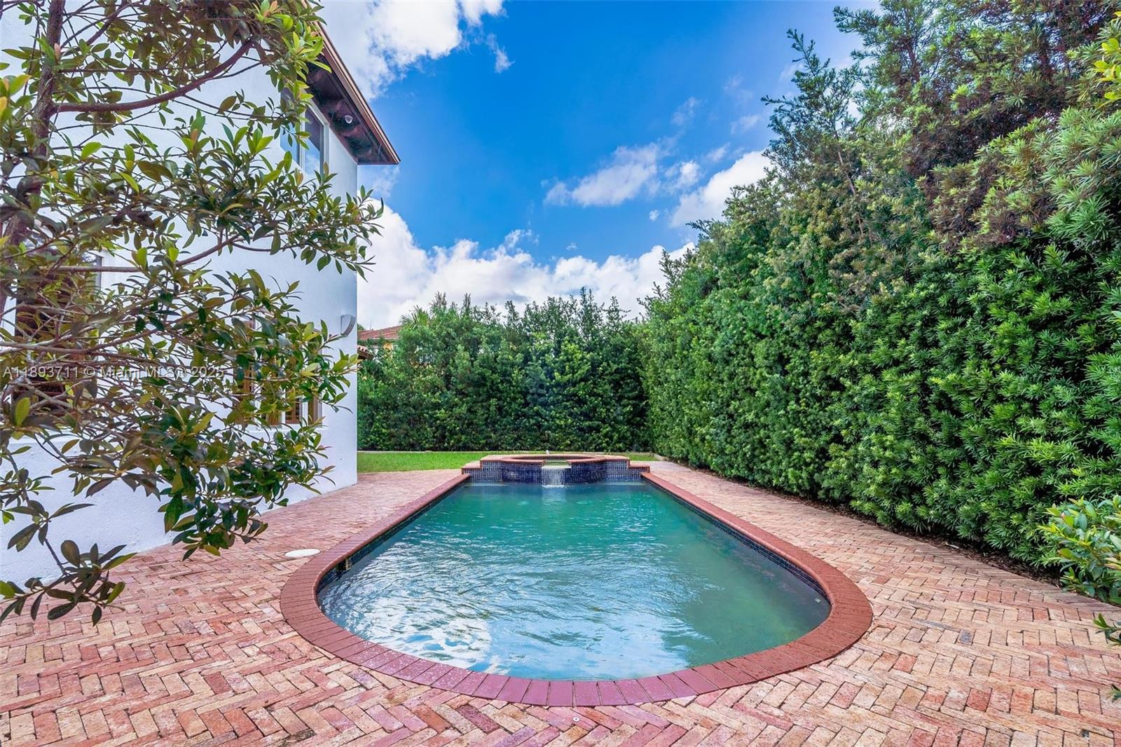 16763 Northwest 77th Path Miami Lakes, FL 33016 - Photo 10 of 53 a view of a swimming pool with a yard