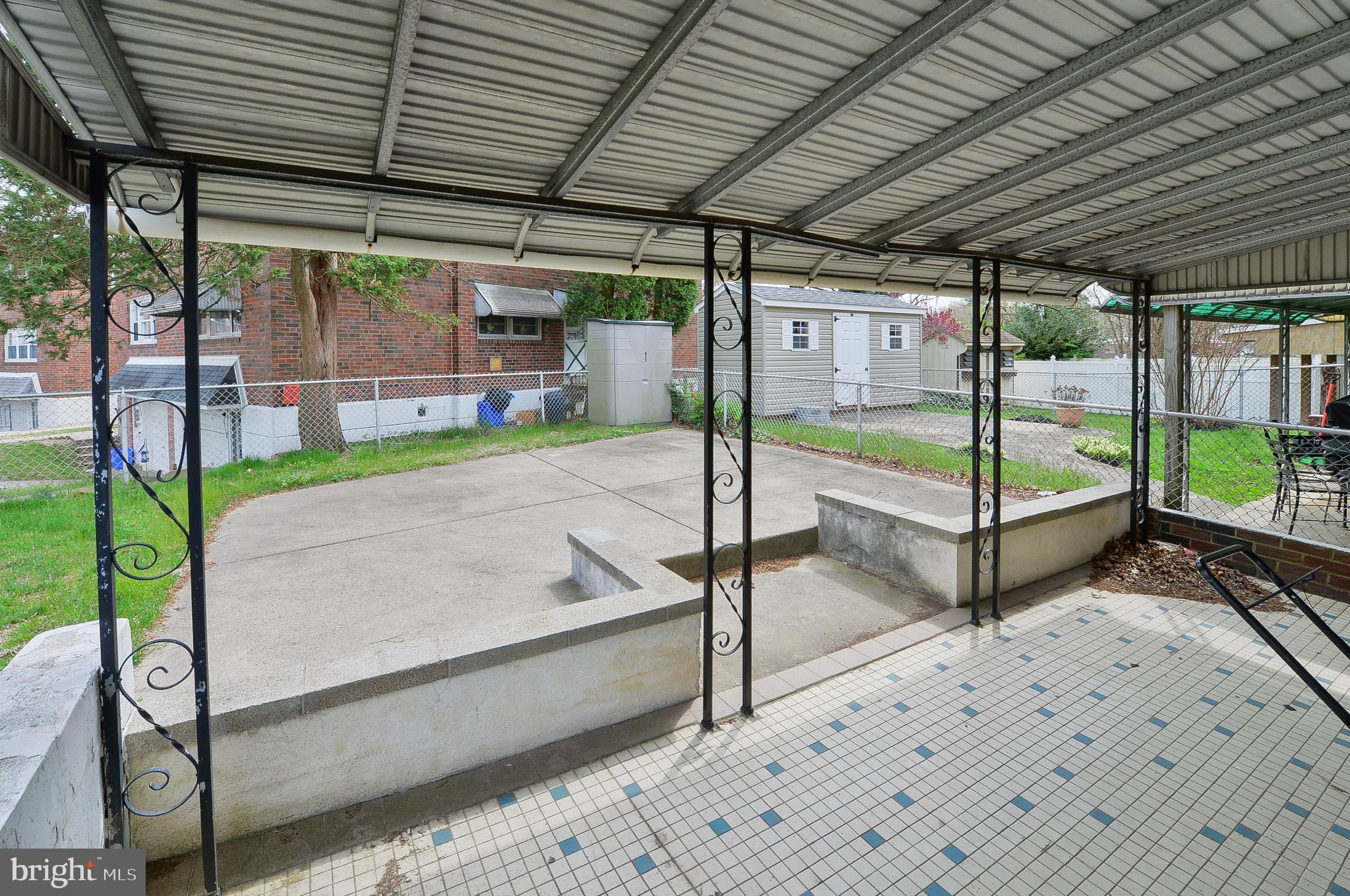 620 Renz Street Philadelphia, PA 19128 - Photo 30 of 32 Covered Tiled Patio overlooking the fenced yard